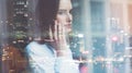 Photo business woman wearing white shirt, talking smartphone. Open space loft office. Panoramic windows, night city background. Wi Royalty Free Stock Photo