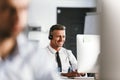 Photo of businesslike man 30s wearing office clothes and headset Royalty Free Stock Photo