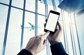 Photo businessman holding modern smartphone hand pushes button.Empty screen Isolated white,airplane take off,airport