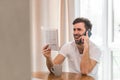 Photo of businessman making a call and reading a documents at his desk in his office. Royalty Free Stock Photo