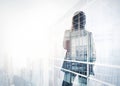 Photo of businesswoman. Double exposure, city on the background. Blurred background, horizontal