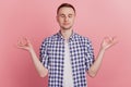 Photo of calm peaceful attractive young man make hands om gesture yoga isolated on pink color background