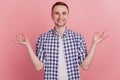 Photo of calm peaceful attractive young man make hands om gesture yoga meditate isolated on pink color background