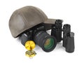 Photo camera, compass, binoculars and cap Royalty Free Stock Photo
