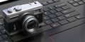 Photo camera on computer keyboard background. 3d illustration Royalty Free Stock Photo