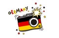 Photo camera with flash in the colors of the Germany national flag