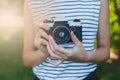 Photo camera in the girl`s hands Royalty Free Stock Photo