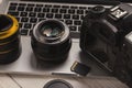 Photo camera lenses and memory card on computer Royalty Free Stock Photo