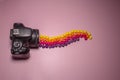 Photo camera and multi-colored candies skills, concept photo