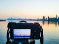 Photo camera on tripod shooting cityscape of Manhattan, NYC downtown. Early morning. Royalty Free Stock Photo