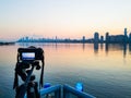 Photo camera on tripod shooting cityscape of Manhattan, NYC downtown. Early morning. Royalty Free Stock Photo