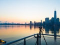 Photo camera on tripod shooting cityscape of Manhattan, NYC downtown. Early morning. Royalty Free Stock Photo