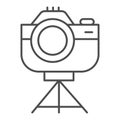 Photo camera on tripod thin line icon, device concept, camera on stand sign on white background, retro photocamera icon