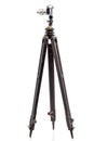 Photo camera on wooden tripod.