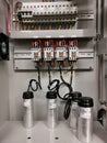 Photo of capacitor bank connection in electrical cabinet. Royalty Free Stock Photo