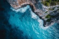 This photo captures an aerial perspective of the expansive ocean meeting tall cliffs in a breathtaking landscape, A panoramic