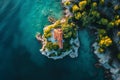 This photo captures an aerial perspective of a house situated in the midst of water, Top view of a remote rocky outpost amidst a