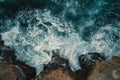 This photo captures an aerial view of the ocean, showcasing the rugged beauty of the rocks beneath the surface, Artistic