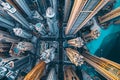 This photo captures a birds-eye view of a bustling cityscape, dominated by numerous towering buildings, An aerial shot of Royalty Free Stock Photo