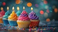 Cupcake Celebration with Bokeh Lights: Colorful Row of Candles and Sweets Royalty Free Stock Photo