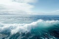 This photo captures a large body of water with a prominent wave forming in the center, A panoramic view of a peaceful ocean with