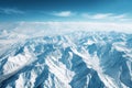 This photo captures a stunning aerial perspective of a mountain range as seen from the window of an airplane, Aerial view of snow- Royalty Free Stock Photo