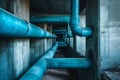 A photo capturing a lengthy arrangement of blue pipes within the interior of a building, Blue pipes crawling through a monolithic Royalty Free Stock Photo