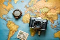 A photo capturing an old camera resting on a map of the world, Top view travel concept with retro camera films, map, and passport Royalty Free Stock Photo