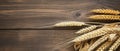 Wheat on Wooden Table, A Collection of Golden Grains in a Rustic Setting Royalty Free Stock Photo