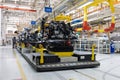 Photo of car bodies are on assembly line. Factory for production of cars. Modern automotive industry