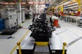 Photo of car bodies are on assembly line. Factory for production of cars. Modern automotive industry