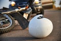 Photo of car, helmet and motorcycle on the road, the concept of road accidents Royalty Free Stock Photo