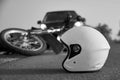 Photo of car, helmet and motorcycle on the road, the concept of road accidents Royalty Free Stock Photo