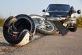 Photo of car, helmet and motorcycle on the road, the concept of road accidents Royalty Free Stock Photo