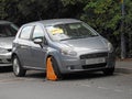 Car vehicle unlawful parking untaxed road transport clamp clamped ticket fine Royalty Free Stock Photo