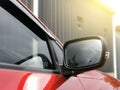 Photo of car rear view mirror with signal lamp and window. Royalty Free Stock Photo