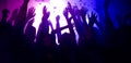 Photo of carefree bachelors clubbers fellows enjoy nightlife dj rock band show raise hands up on bright filter festival