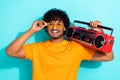 Photo of carefree guy summer vibe listen retro vintage oldschool boombox atmosphere discotheque isolated on aquamarine Royalty Free Stock Photo