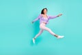 Photo of carefree inspired sporty lady jump run go wear purple cardigan pants shoes isolated turquoise color background