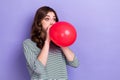 Photo of carefree positive crazy lady hold blow inflate big air balloon look empty space gift shop isolated on purple