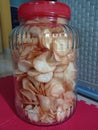 A photo of cassava chips that is contained in a jar