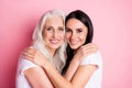 Photo of charming aged mother young pretty daughter two ladies good mood hugging best friends through years wear casual Royalty Free Stock Photo