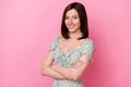 Photo of charming cheerful lady wear green clothes arms folded empty space pink color background