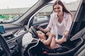 Photo of charming cheerful mom daughter wear casual outfits smiling putting safety seat inside automobile vehicle Royalty Free Stock Photo