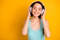 Photo of charming cute nice fascinating pretty sweet woman listening to her favorite musician while isolated with yellow Royalty Free Stock Photo