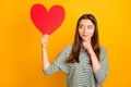 Photo of charming cute suspicious woman thinking on what guy of three ones she has will get this heart while isolated