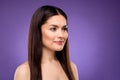 Photo of charming dreamy attractive woman look empty space moisturizing skin cream isolated on violet color background Royalty Free Stock Photo