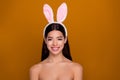 Photo of charming flawless skin asian girl bunny ears easter concept bare skinny shoulders pastel background