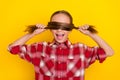 Photo of charming funny schoolkid dressed plaid shirt tails close eyes isolated yellow color background