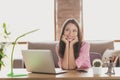 Photo of charming funny young lady wear pink shirt sitting table browsing modern device indoors room home house